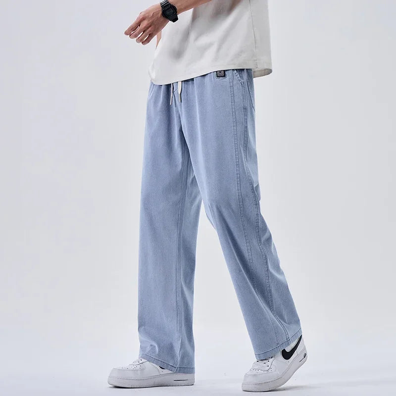 Pantalones vaqueros suaves de marca para hombre, de primavera, finos, drapeados, cómodos, rectos, con cordón, holgados, estilo urbano