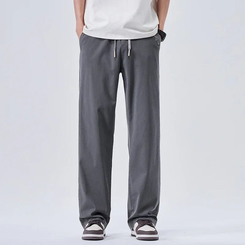 Pantalones vaqueros suaves de marca para hombre, de primavera, finos, drapeados, cómodos, rectos, con cordón, holgados, estilo urbano