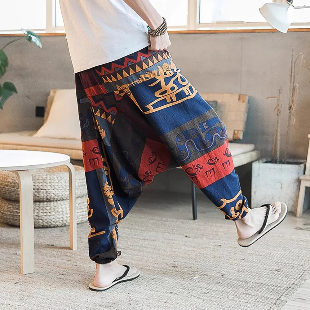 Pantalones harén vintage con estilo para hombre, diseño de entrepierna caída, pantalones casuales, pantalones bohemios holgados y transpirables, pantalones deportivos con estampado aleatorio