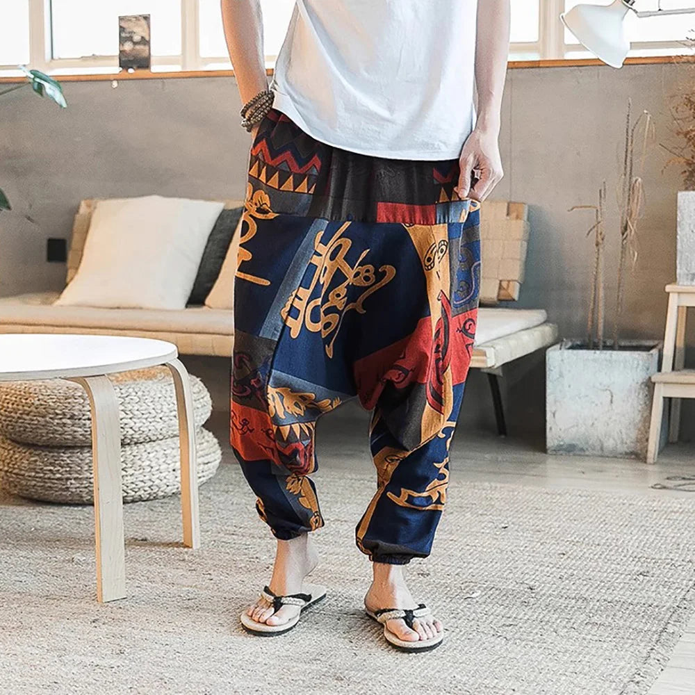 Pantalones harén vintage con estilo para hombre, diseño de entrepierna caída, pantalones casuales, pantalones bohemios holgados y transpirables, pantalones deportivos con estampado aleatorio