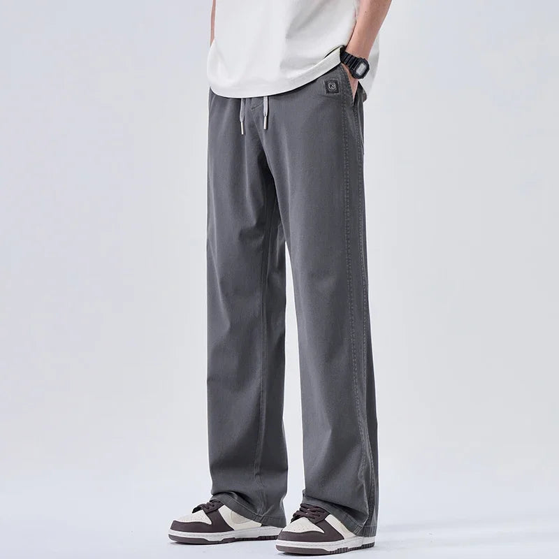 Pantalones vaqueros suaves de marca para hombre, de primavera, finos, drapeados, cómodos, rectos, con cordón, holgados, estilo urbano