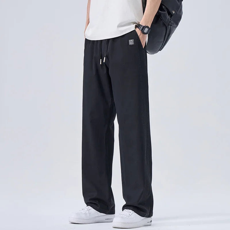 Pantalones vaqueros suaves de marca para hombre, de primavera, finos, drapeados, cómodos, rectos, con cordón, holgados, estilo urbano