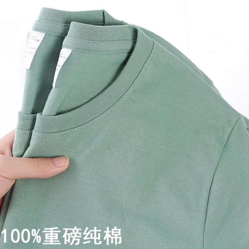 Camiseta 100% algodón para hombre y mujer, color liso, cuello redondo, manga corta, camiseta coreana holgada de media manga, unisex, tallas M-4XL