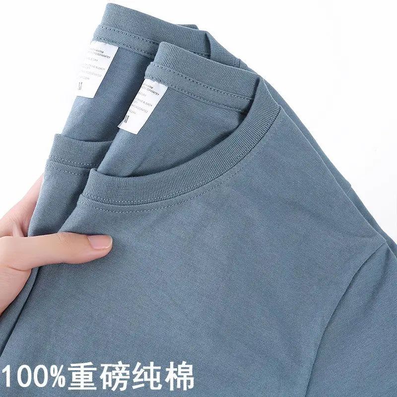Camiseta 100% algodón para hombre y mujer, color liso, cuello redondo, manga corta, camiseta coreana holgada de media manga, unisex, tallas M-4XL