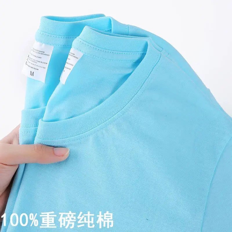 Camiseta 100% algodón para hombre y mujer, color liso, cuello redondo, manga corta, camiseta coreana holgada de media manga, unisex, tallas M-4XL