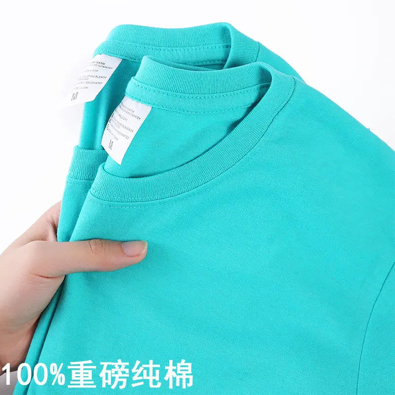 Camiseta 100% algodón para hombre y mujer, color liso, cuello redondo, manga corta, camiseta coreana holgada de media manga, unisex, tallas M-4XL