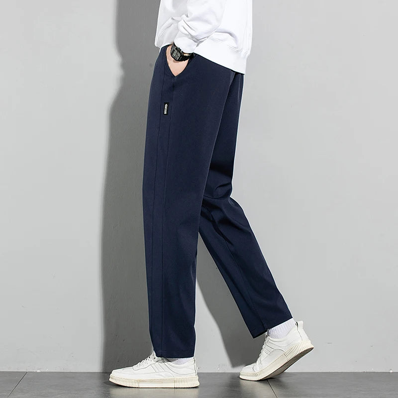 Pantalones de seda de hielo para hombre, novedad de verano 2025, negros, grises, finos, informales, de negocios, para exteriores, elásticos, transpirables, de pierna recta.