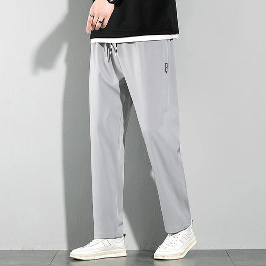 Pantalones de seda de hielo para hombre, novedad de verano 2025, negros, grises, finos, informales, de negocios, para exteriores, elásticos, transpirables, de pierna recta.