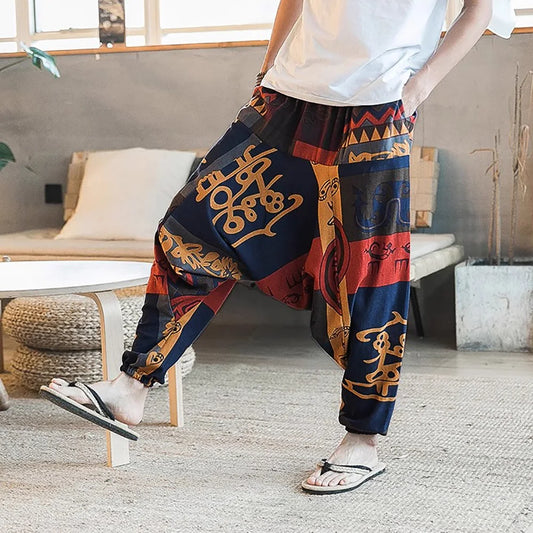 Pantalones harén vintage con estilo para hombre, diseño de entrepierna caída, pantalones casuales, pantalones bohemios holgados y transpirables, pantalones deportivos con estampado aleatorio 